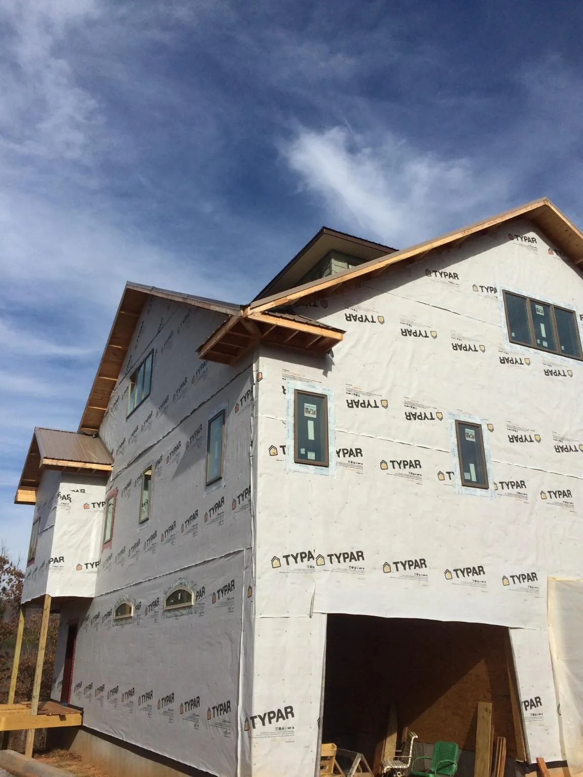 Stick built house wrapped in Typar with new roof framing and dormers in Adams